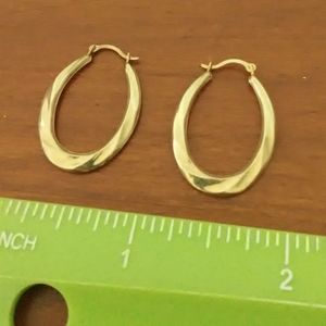 Medium oval hoop gold tone earrings